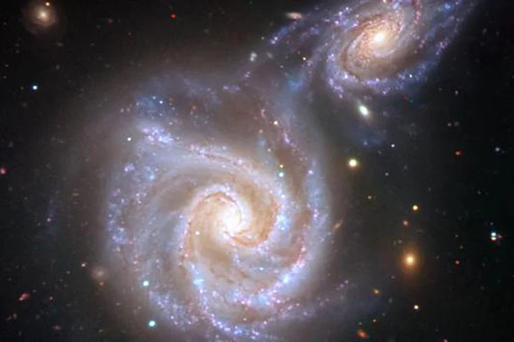 An artist's impression of a collision between the Milky Way and a smaller dwarf galaxy, such as that which occurred about eight to 10 billion years ago