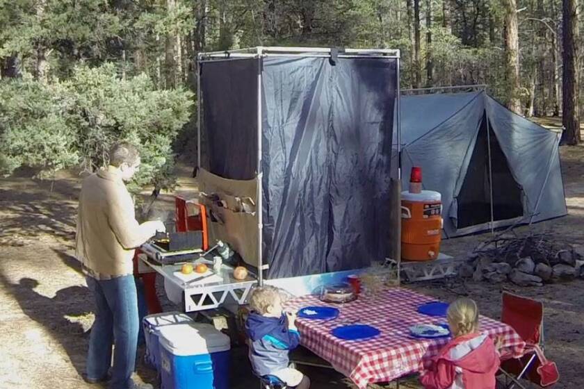 CW-19 set up with shower stall and other accessories at camp