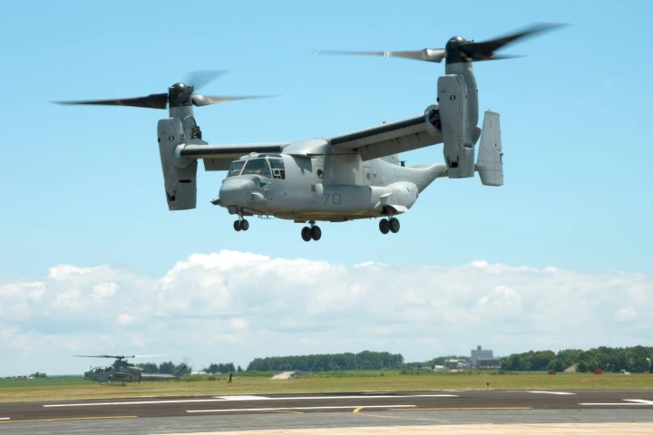 An MV-22B Osprey equipped with a 3-D printed titanium link and fitting inside an engine nacelle maintains a hover during a July 29 demonstration at Patuxent River Naval Air Station