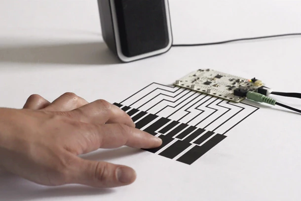 Touch Board turns any conductive material into a potential capacitive touch input, like this "piano"