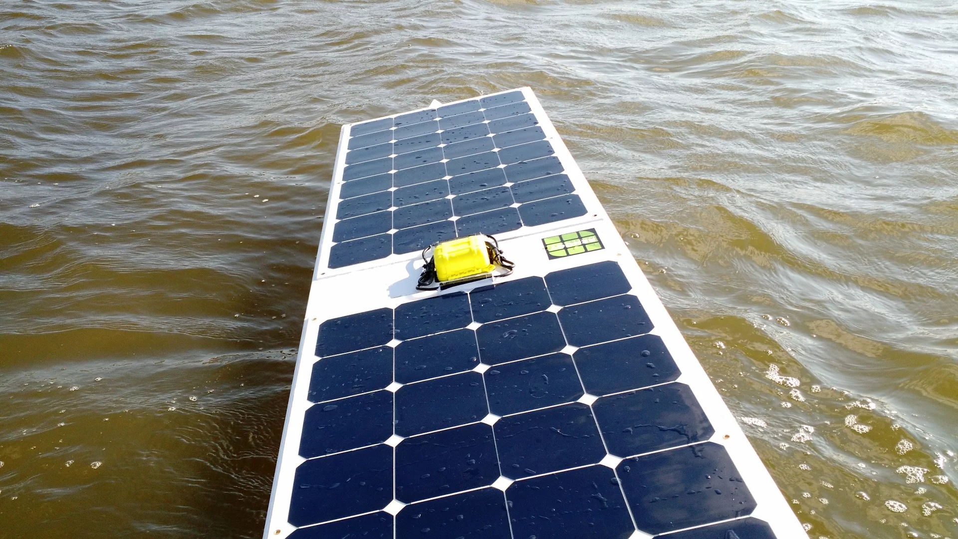 The Arduino, GPS and satellite modem are all kept watertight in the yellow housing between the PV panels