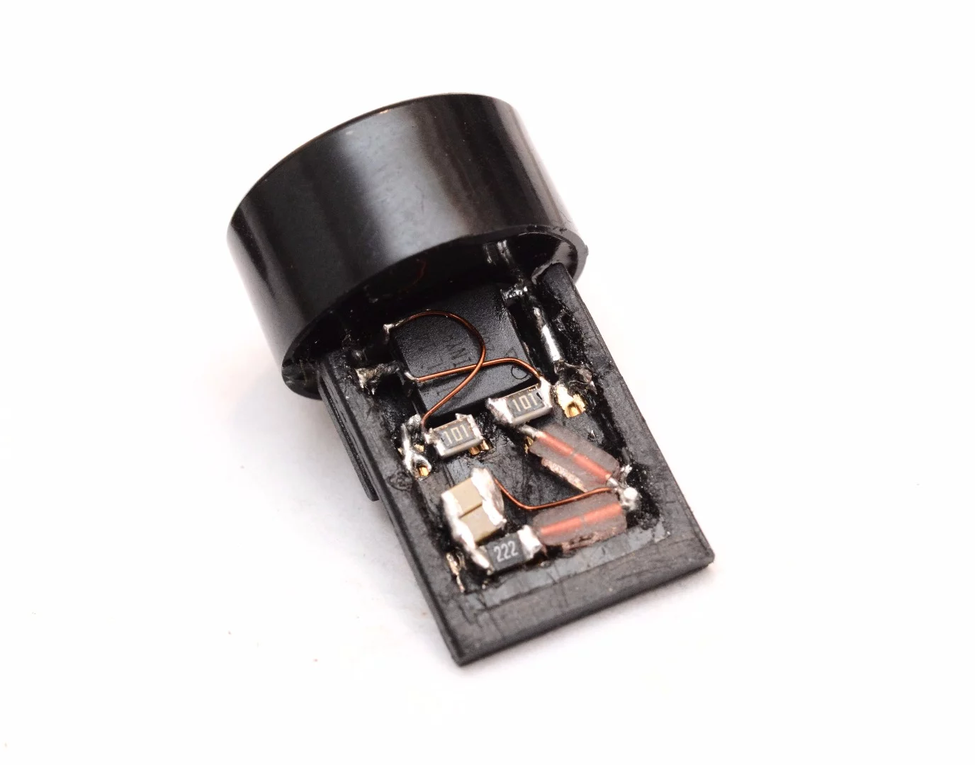 The electronics are all squeezed, shaved and shoved into the plastic frame of a USB plug