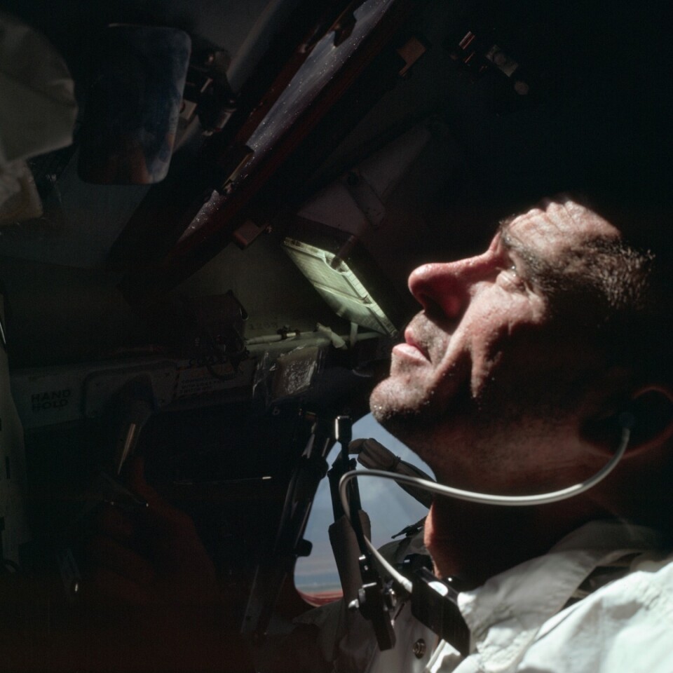 Apollo 7, Lunar Module Pilot, R. Walter Cunningham working inside the Command Module