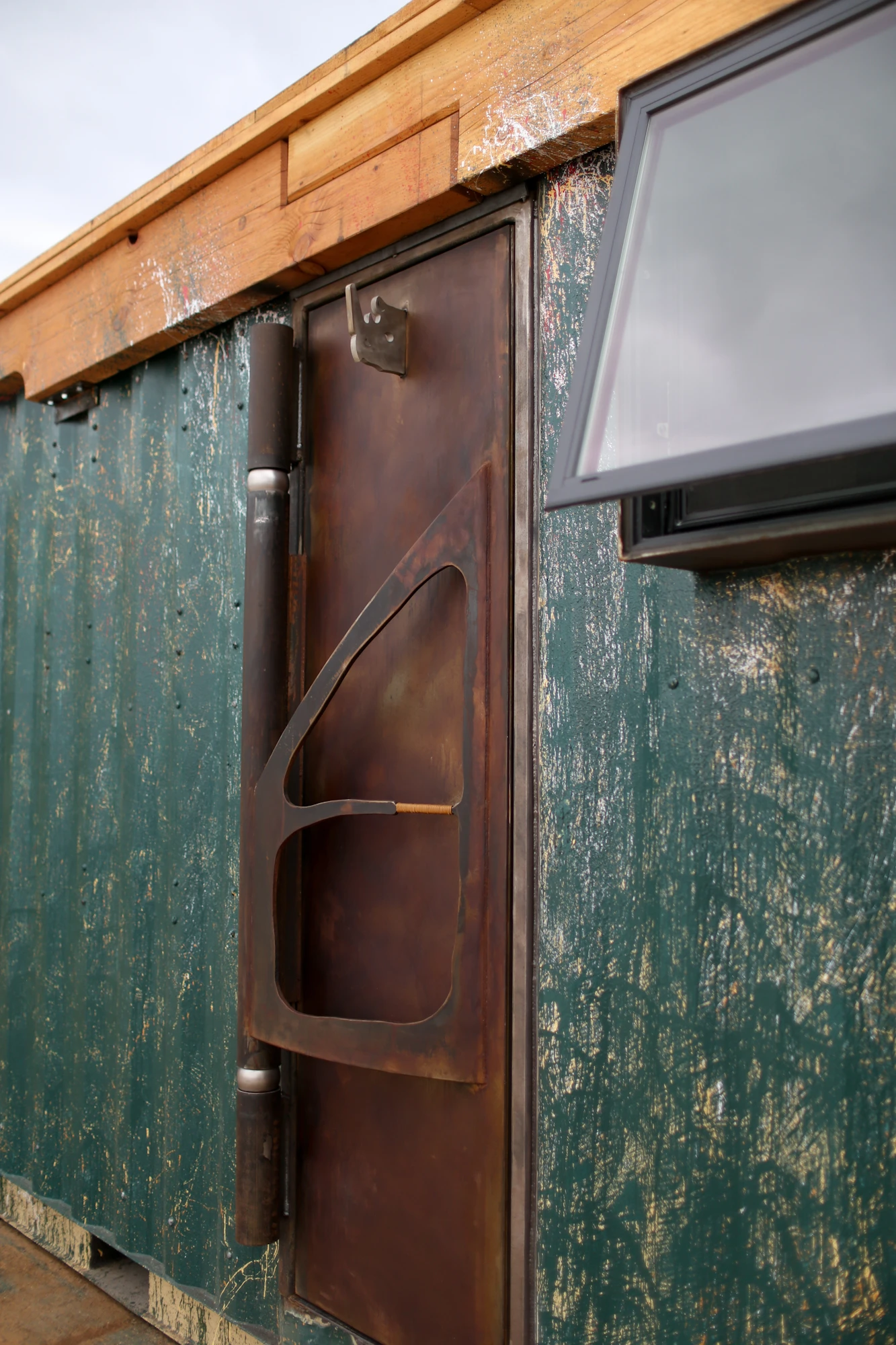 The home sports small artistic touches such as a steel Rhino horn sculpture on the outside (Photo: Rhino Cubed)