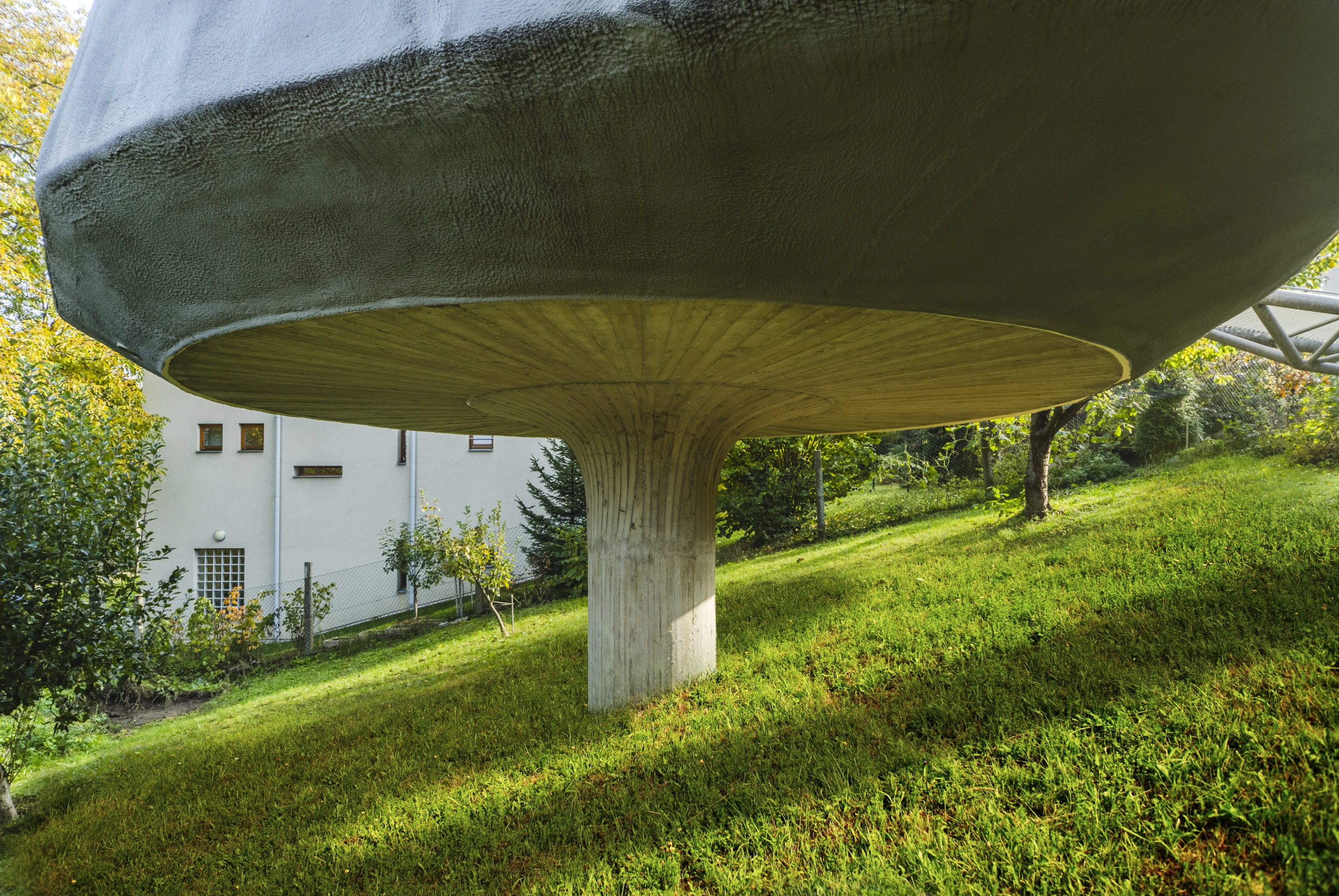 Architect Jan Šépka told us that the unusual concrete stilt the House in the Orchard sits atop was used because it was much cheaper than typical foundations would be on such a sloped site