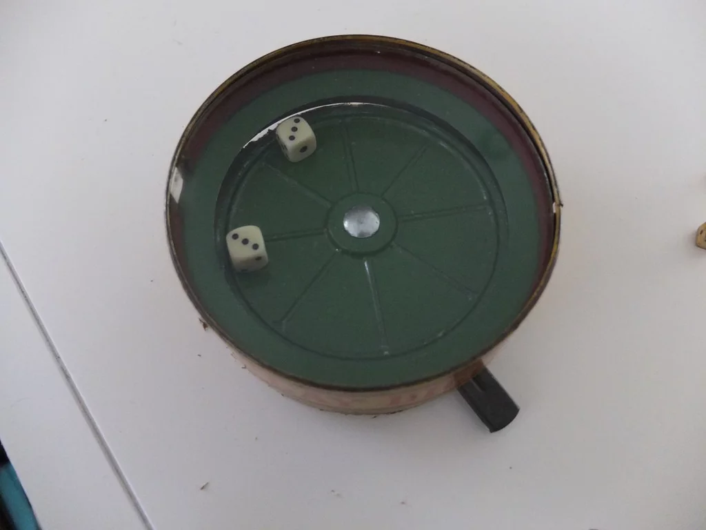 When the motor is activated, the ridged base spins and disturbs the dice