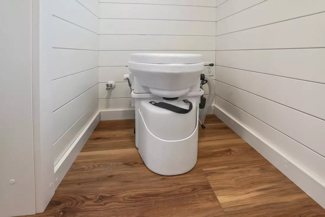 The Ulla-Carin's bathroom contains a composting toilet, sink, and shower