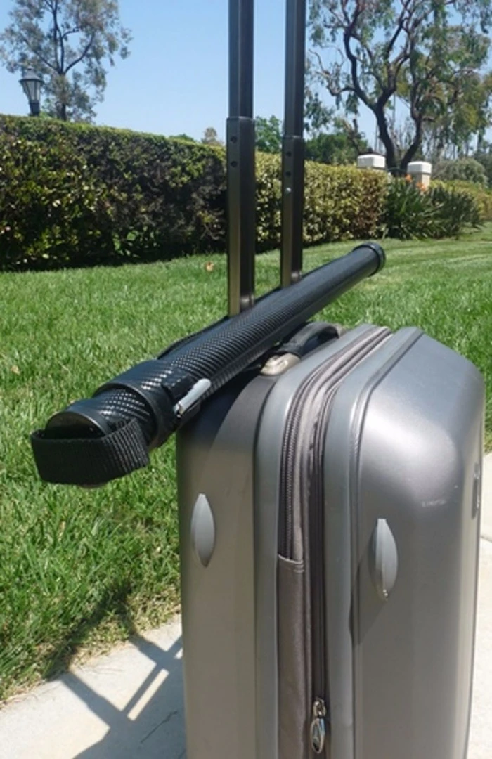 The RainBender strap doubles as a luggage strap