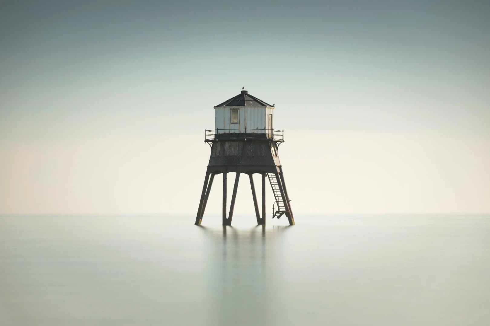 Long Exposure shot of the Old Victorian Lighthouse off the coast of Dovercourt, Essex. 40 Second exposure taken at high tide on an overcast day on 17th February 2018