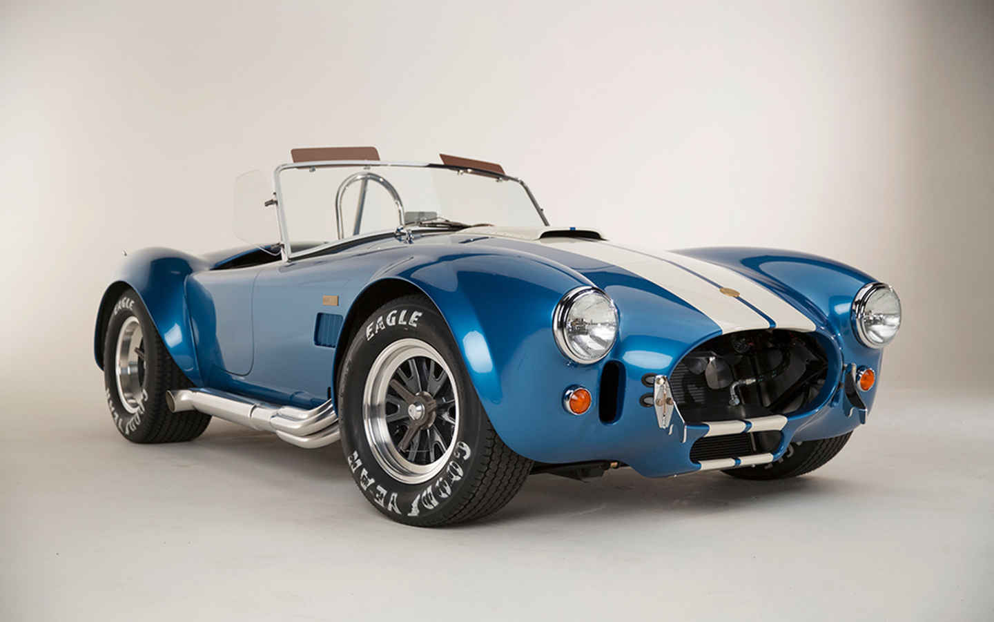 Each continuation Cobra will be painted Guardsman Blue with Wimbledon White stripes, equipped with a premium black leather interior and other special touches and the car will make it's public debut at the Barrett-Jackson Auction in Scottsdale, Arizona on January 12, 2015.