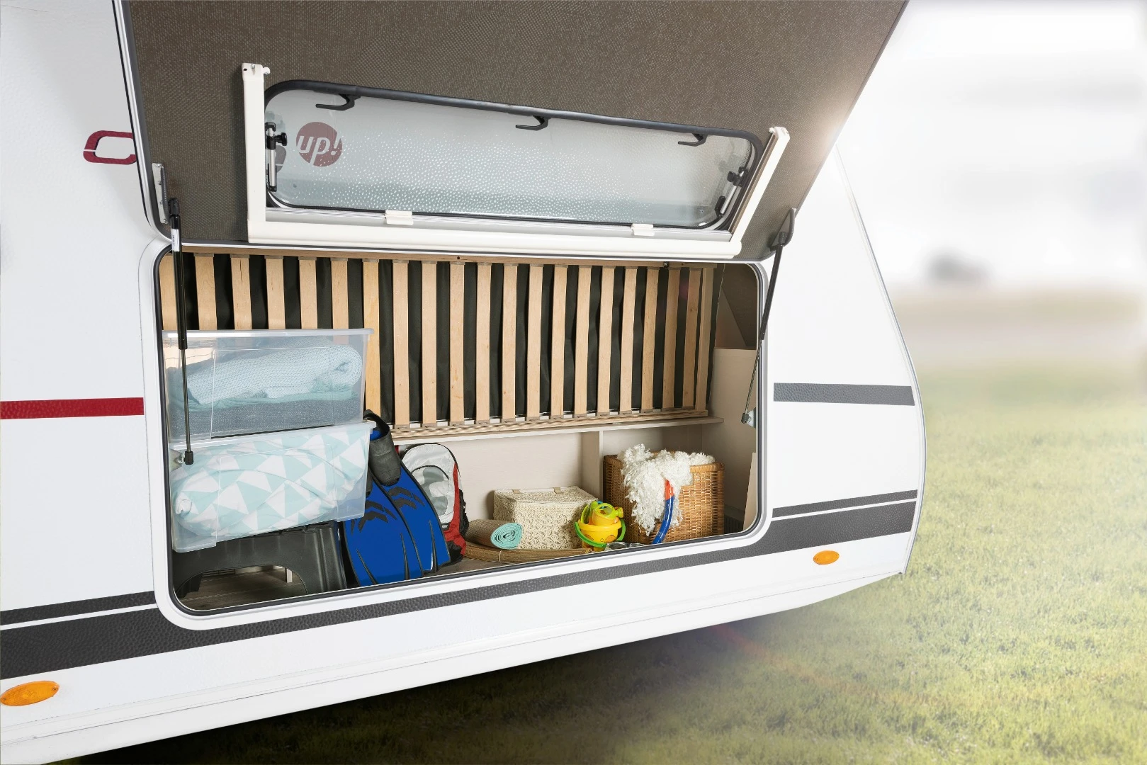The foldaway lower bunk is located next to a storage hatch