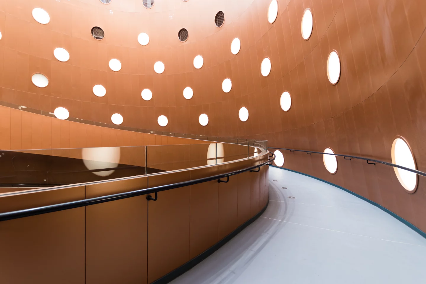 The Exploratorium's central cone is navigated using a spiraling ramp that ascents from ground level to top