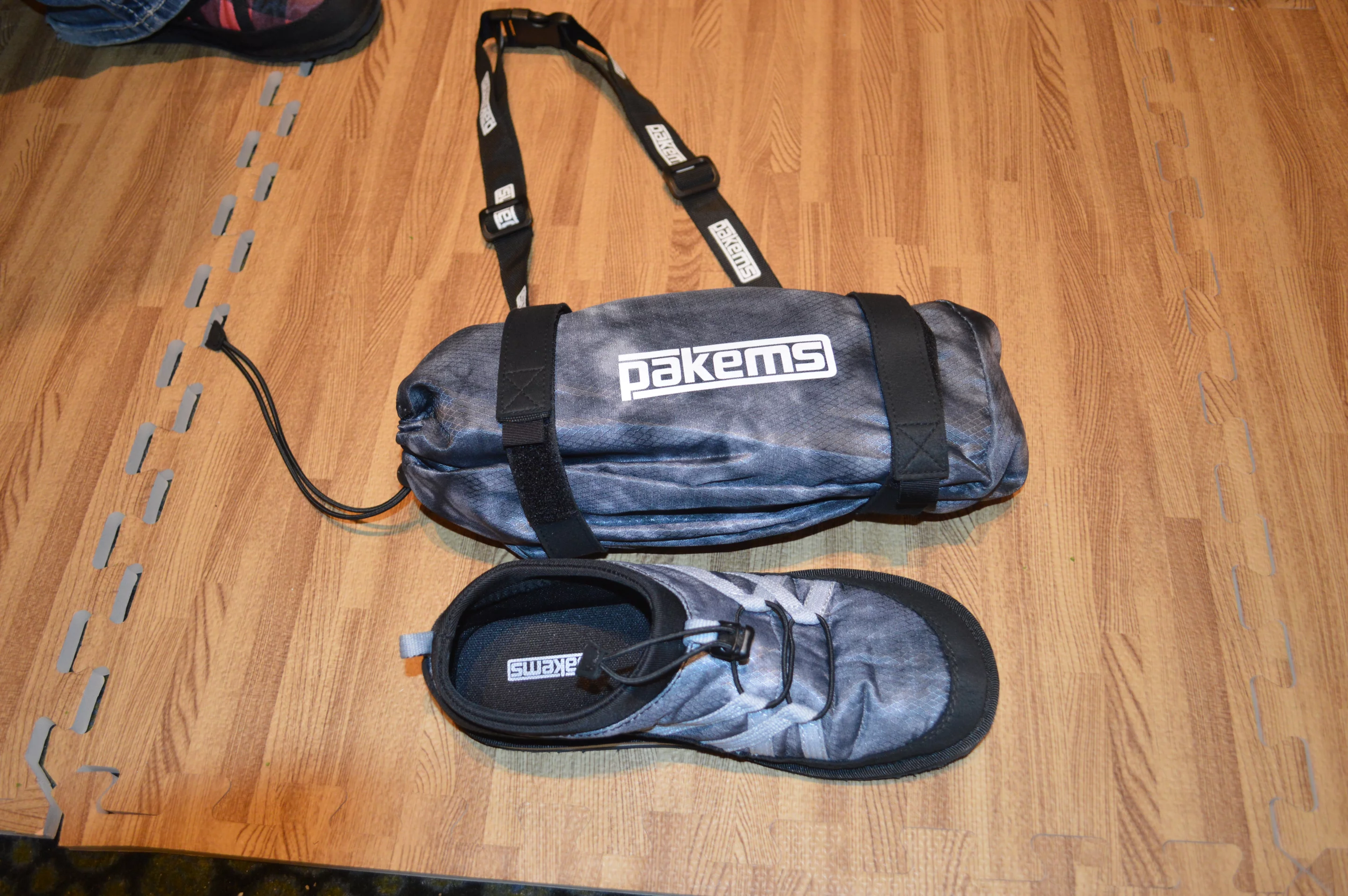 The two Pakems shoes pack into the included carry bag