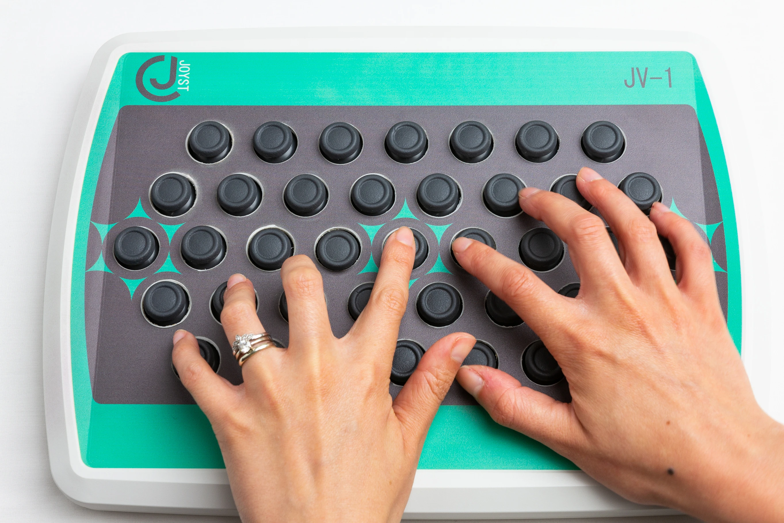 Midi Controller Hand MIDI controller uses mini joysticks for expressive music creation