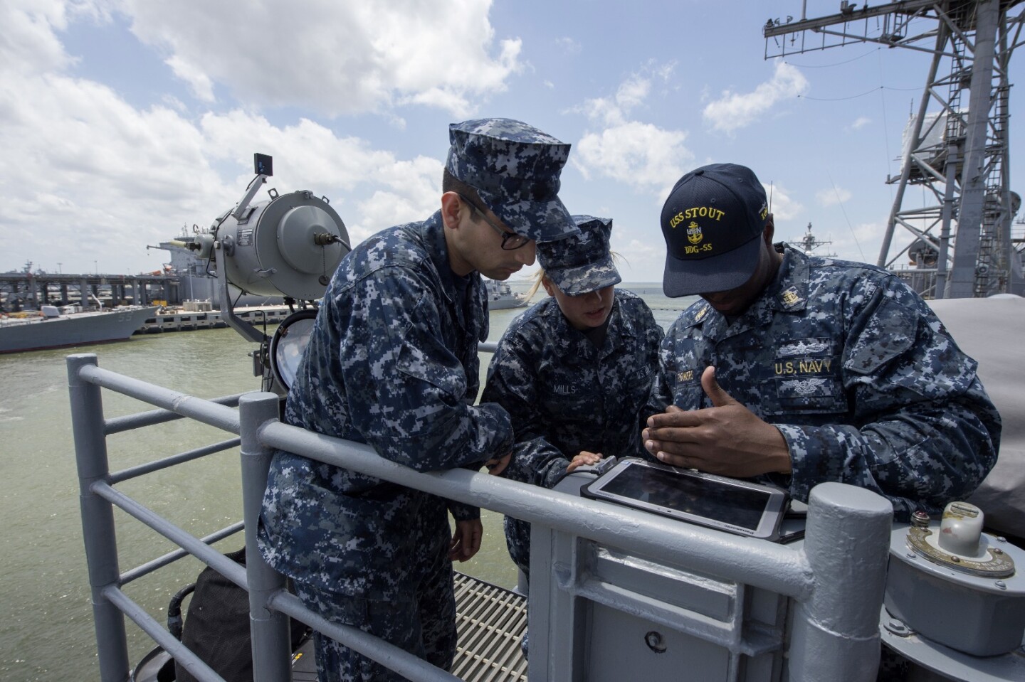 Chief Quartermaster Gregory Flowers from the guided-missile destroyer USS Stout (DDG 55) types a message during a demonstration of the Flashing Light to Text Converter (FLTC)