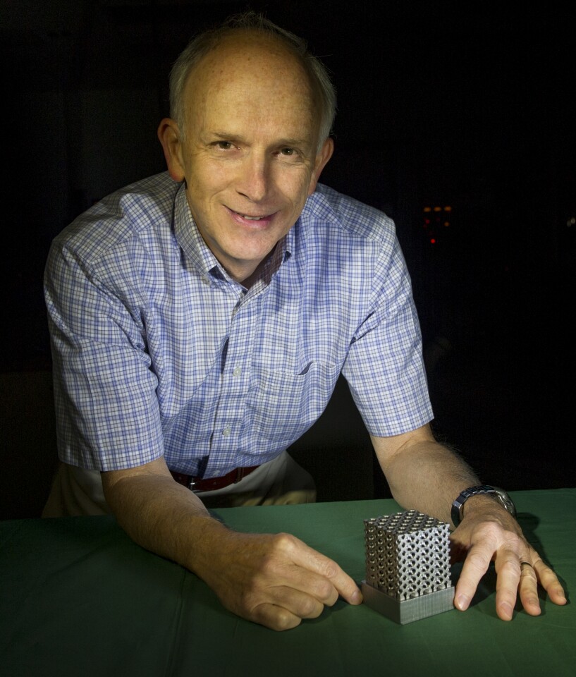 NASA technologist Tim Stephenson with a structure made of Invar (Photo: NASA Goddard/Bill Hrybyk)