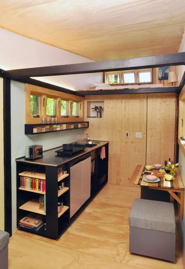 The kitchen features a low-flow faucet and plenty of worktop space