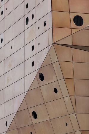 The Energy Tower has lighting between its inner and outer skins that is visible through the perforated outer skin