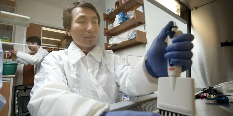 Researcher John Law in the University of Alberta lab of Michael Houghton