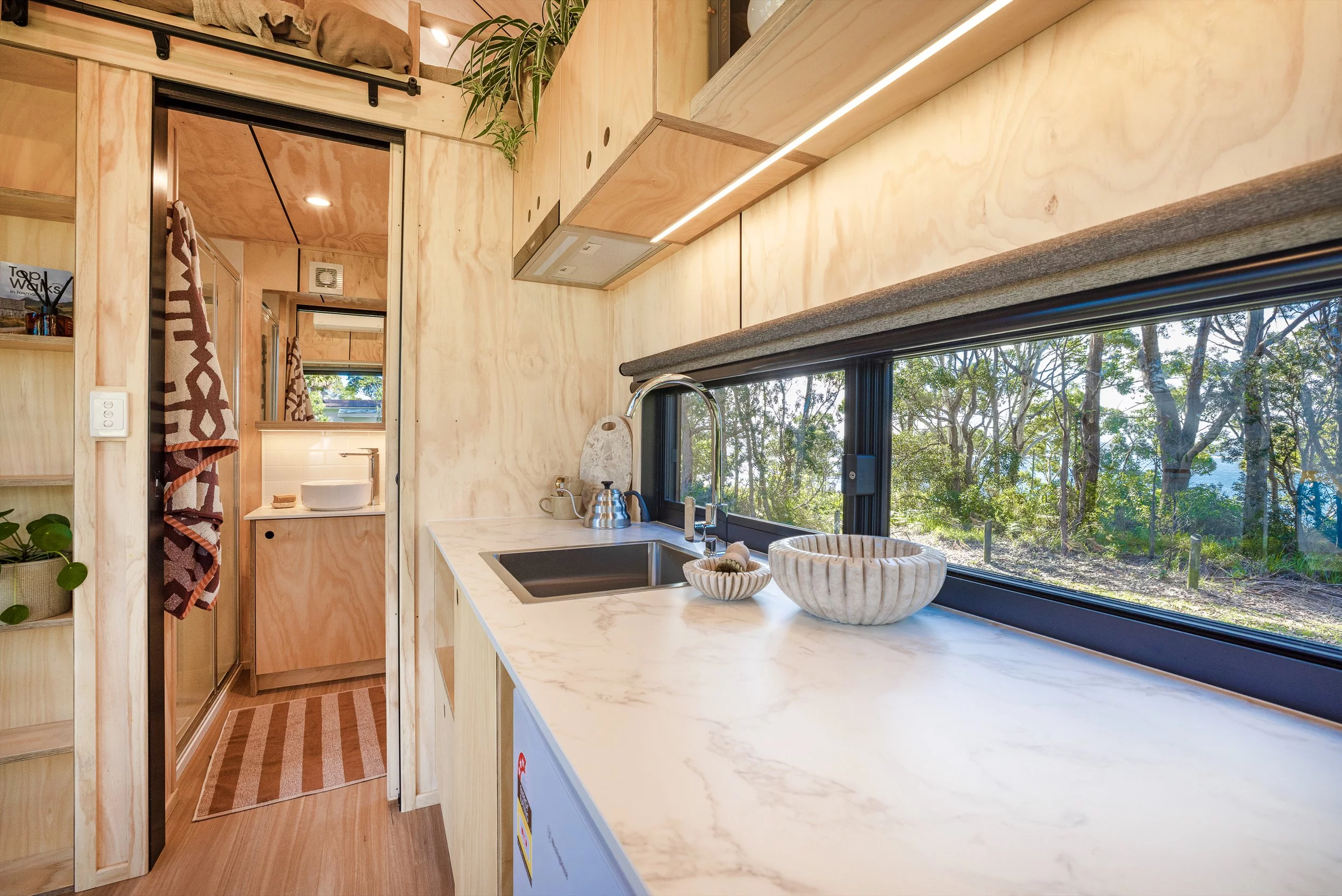 The Five Four's bathroom is accessed by a sliding door