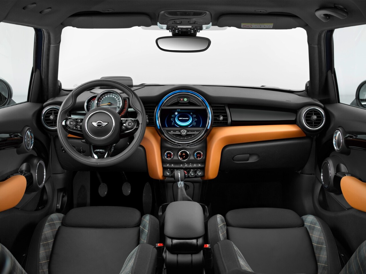 The dashboard is mounted on the steering column with instruments behind the steering wheel and there's an optional central console color display