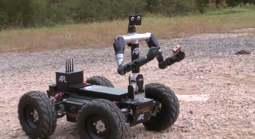 Johns Hopkins University's Bimanual Dexterous Robotics Platform successfully disconnects the wire from a mock IED