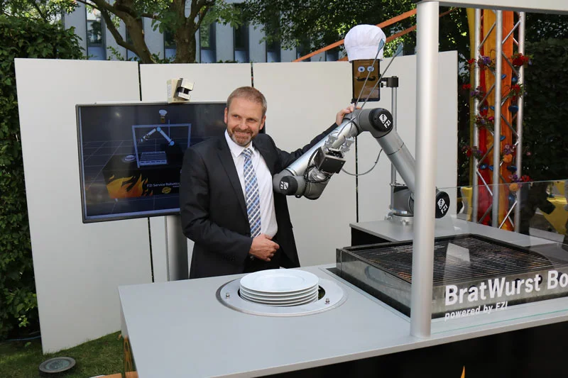 State Secretary Volker Ratzman with BratWurst Bot
