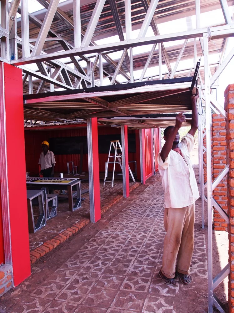 Shutters can be opened to turn the classrooms into a semi-outdoor space (Photo: Architecture for a change)