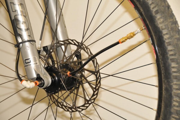 ADAPTRAC is a frame-mounted compressed air system that allows mountain bikers to change the air pressure in their tires, as they're riding