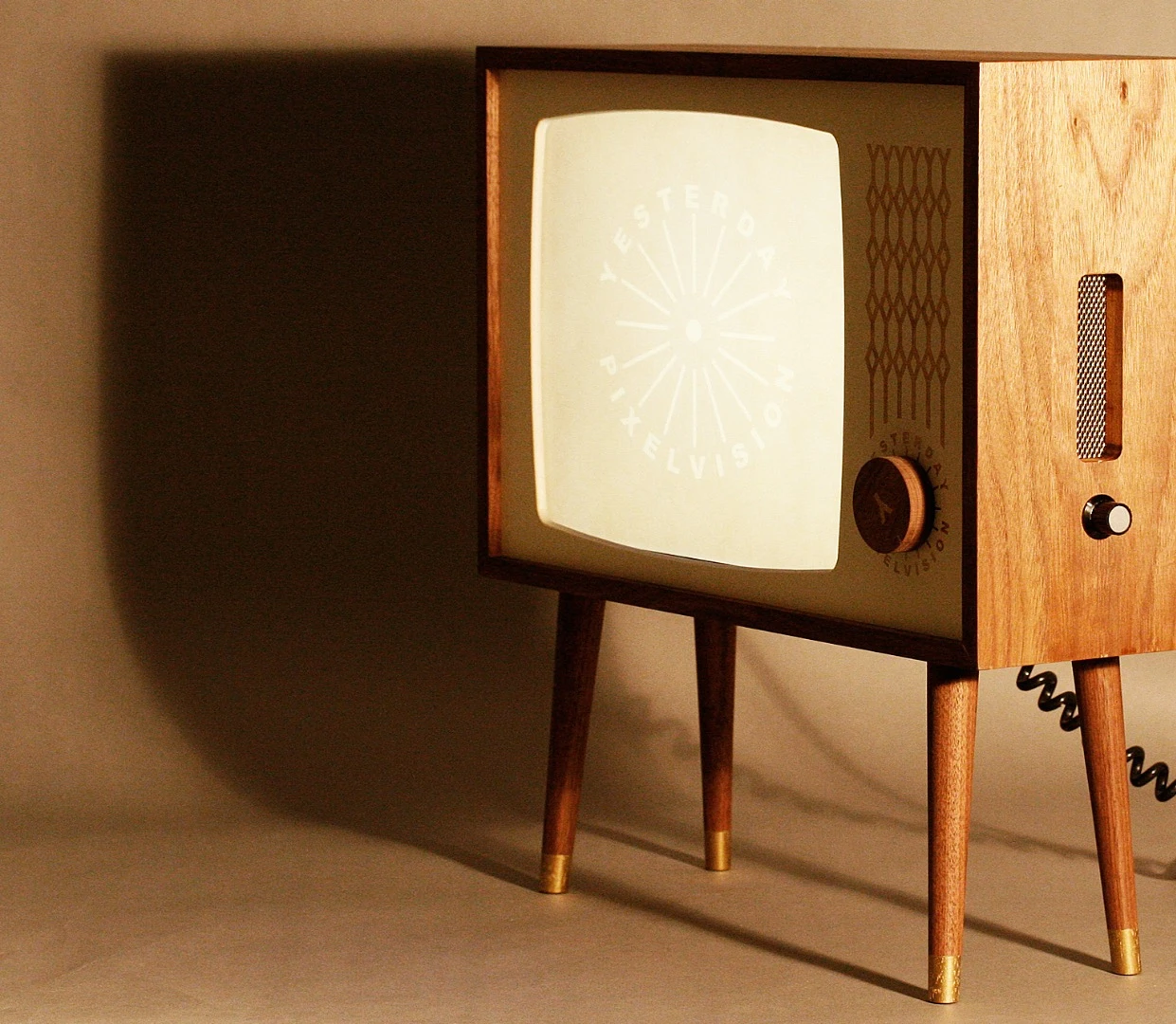 Yesterday Vision is a series of wooden enclosures for LCD televisions and monitors designed to replicate old TVs from the 1950s and 60s