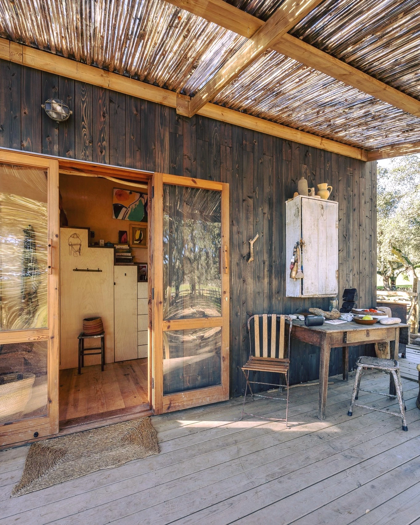 The Brava's porch area includes a table and chairs, plus a little storage space