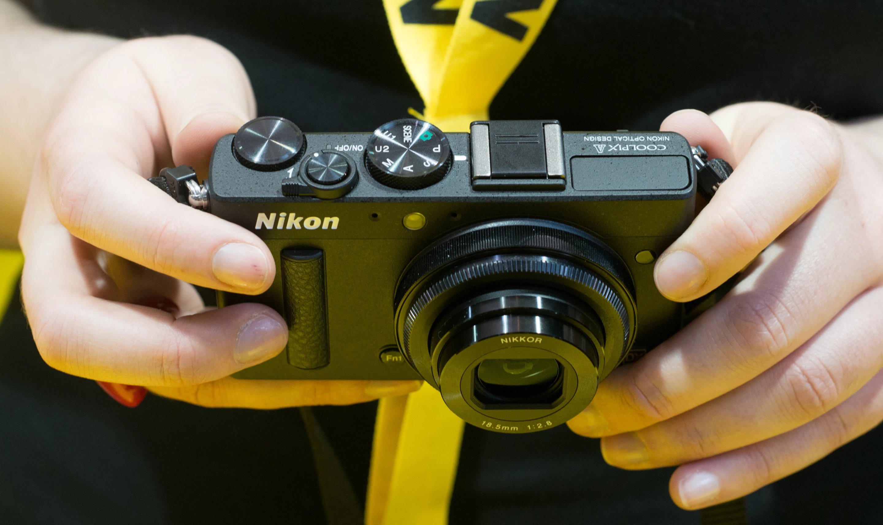 The lens on the Nikon COOLPIX A is a 18.5mm F2.8 lens equivalent of 28mm in 35mm format