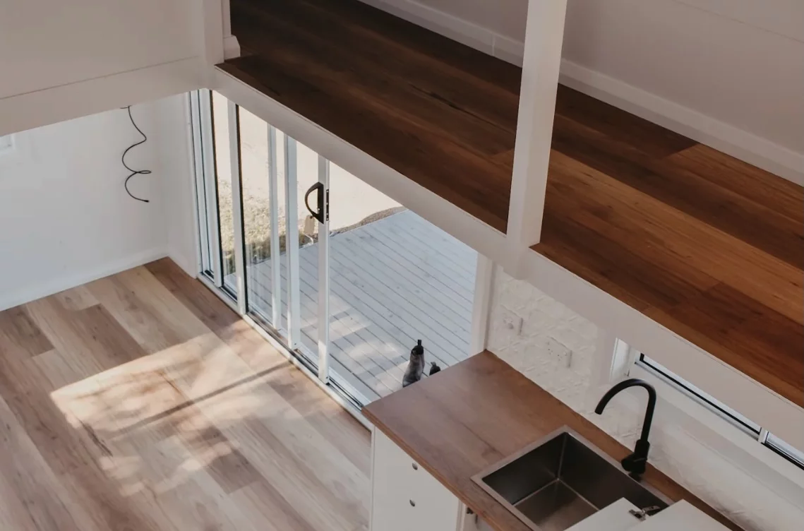 The Joely's sliding glass doors open up the living room to the outside