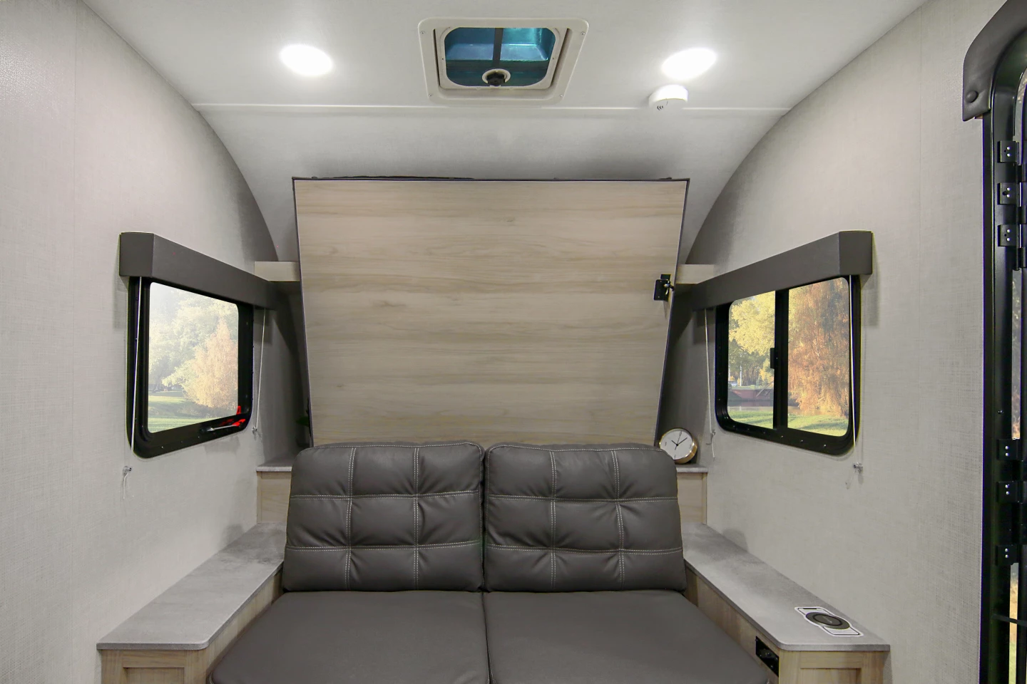 One floor plan includes a Murphy bed that folds over the couch at night