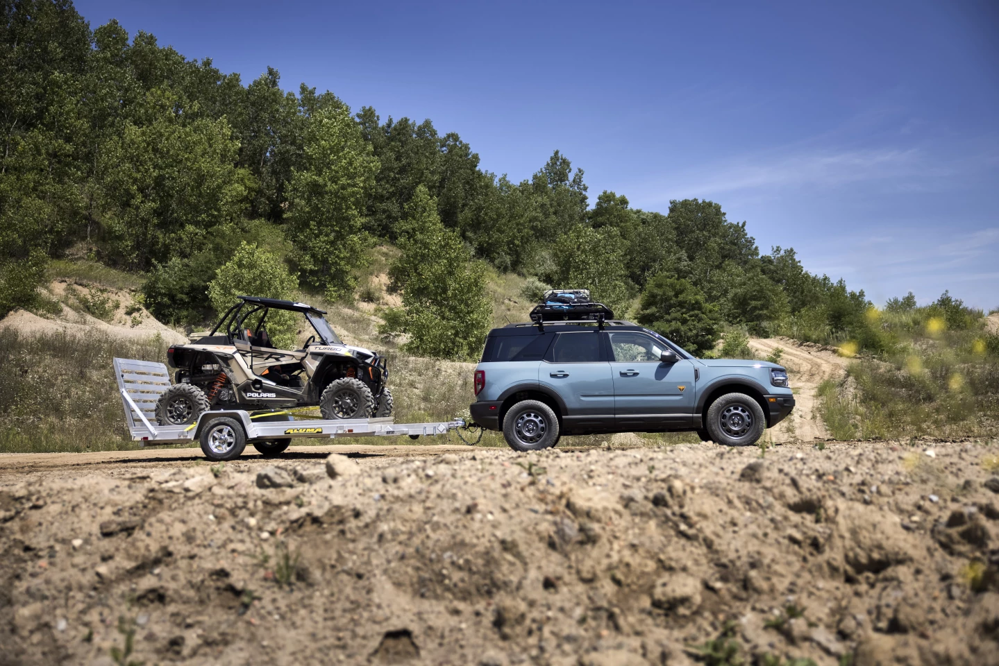 Two icons of off-roading: Ford Bronco (Sport) and Polaris RZR (XP Turbo 1000)