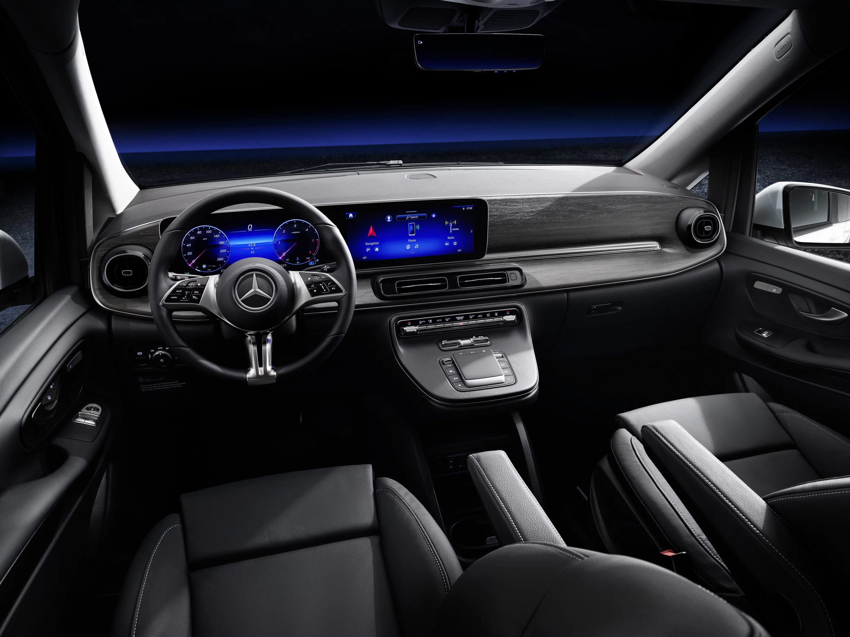 The cockpit features a dual digital display with MBUX infotainment