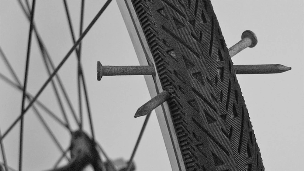 @cme drives nails into the Hutchinson Serenity tires to demonstrate their durability