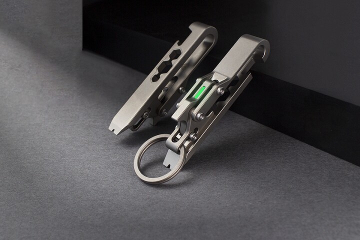 Front and back of silver multi-tool on gray background