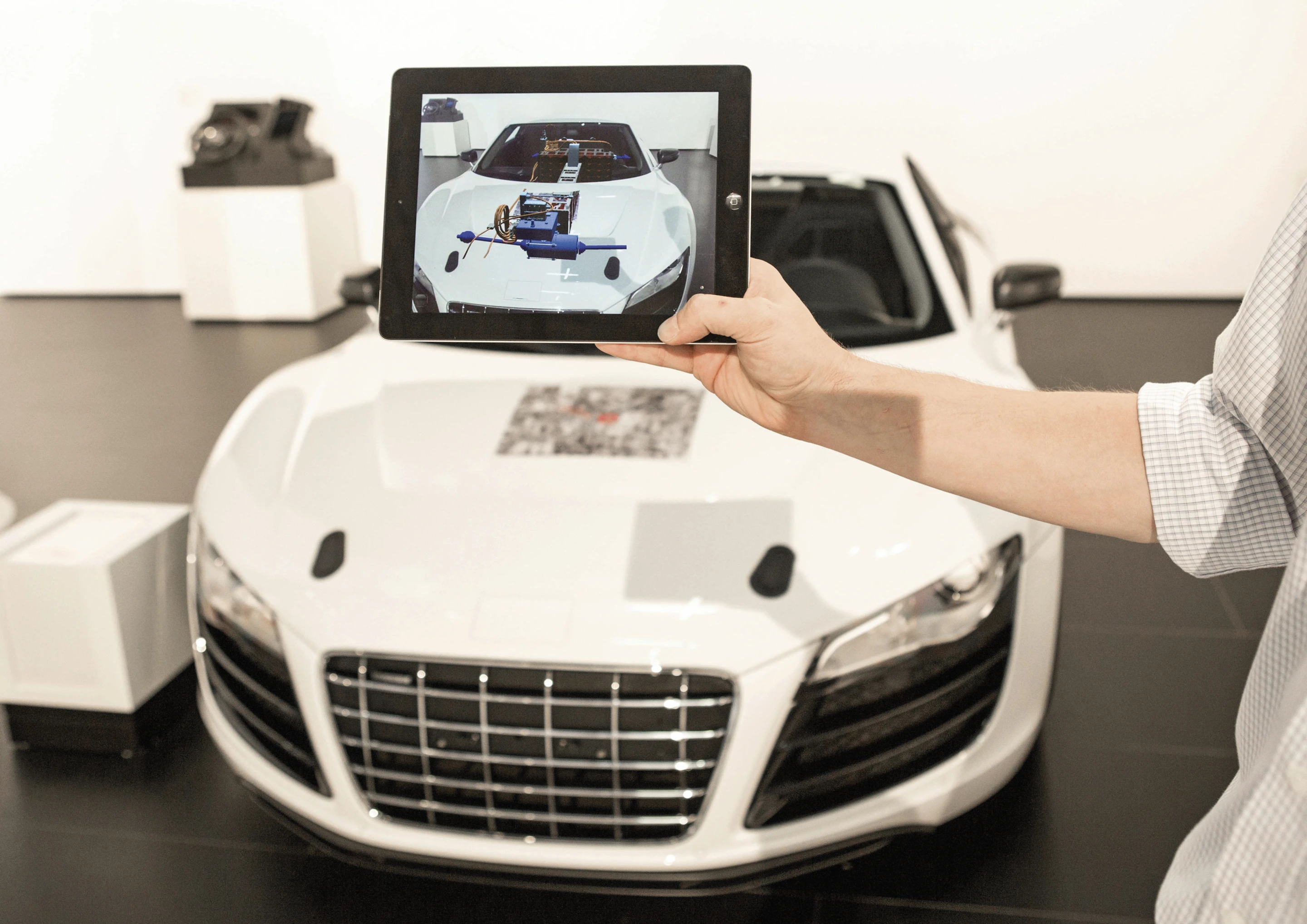 Various F12 operations can be controlled by a removable tablet that fits into the center console