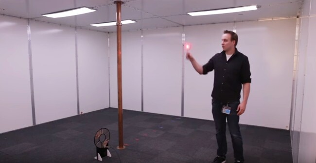 Scientist Matt Chabalko powers up an LED light in the room