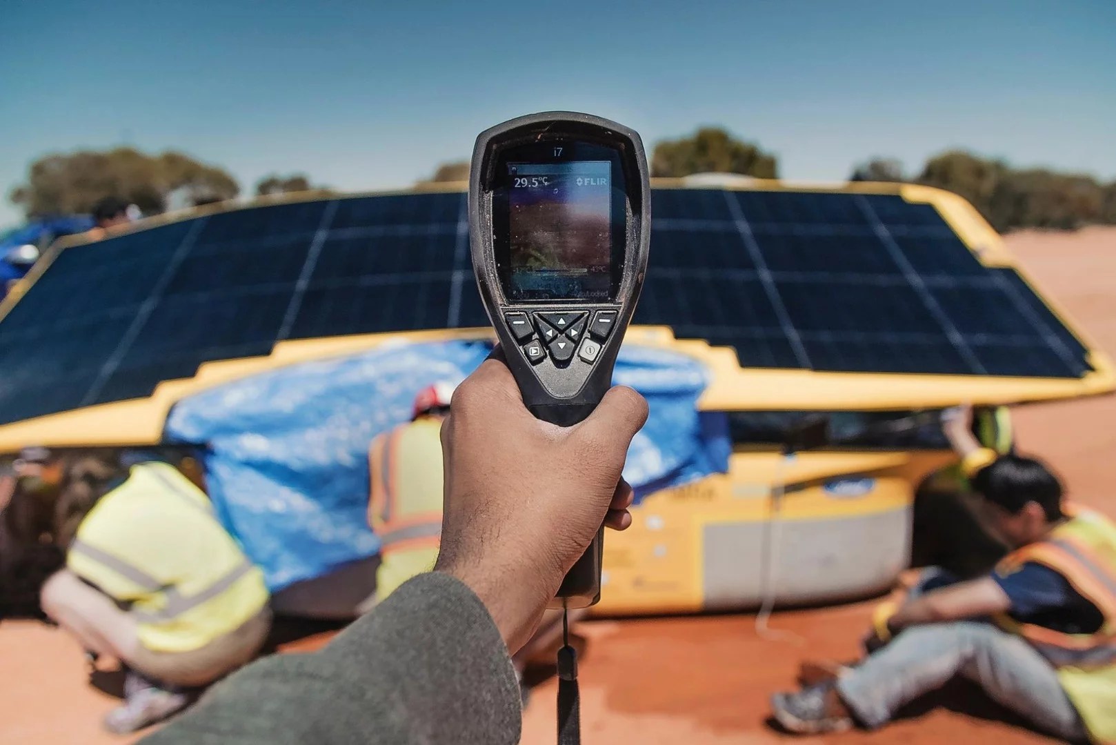 The University of Michigan team charging its Aurum solar car ahead of the World Solar Challenge, using an IR camera to see which parts of the solar panel array are hottest