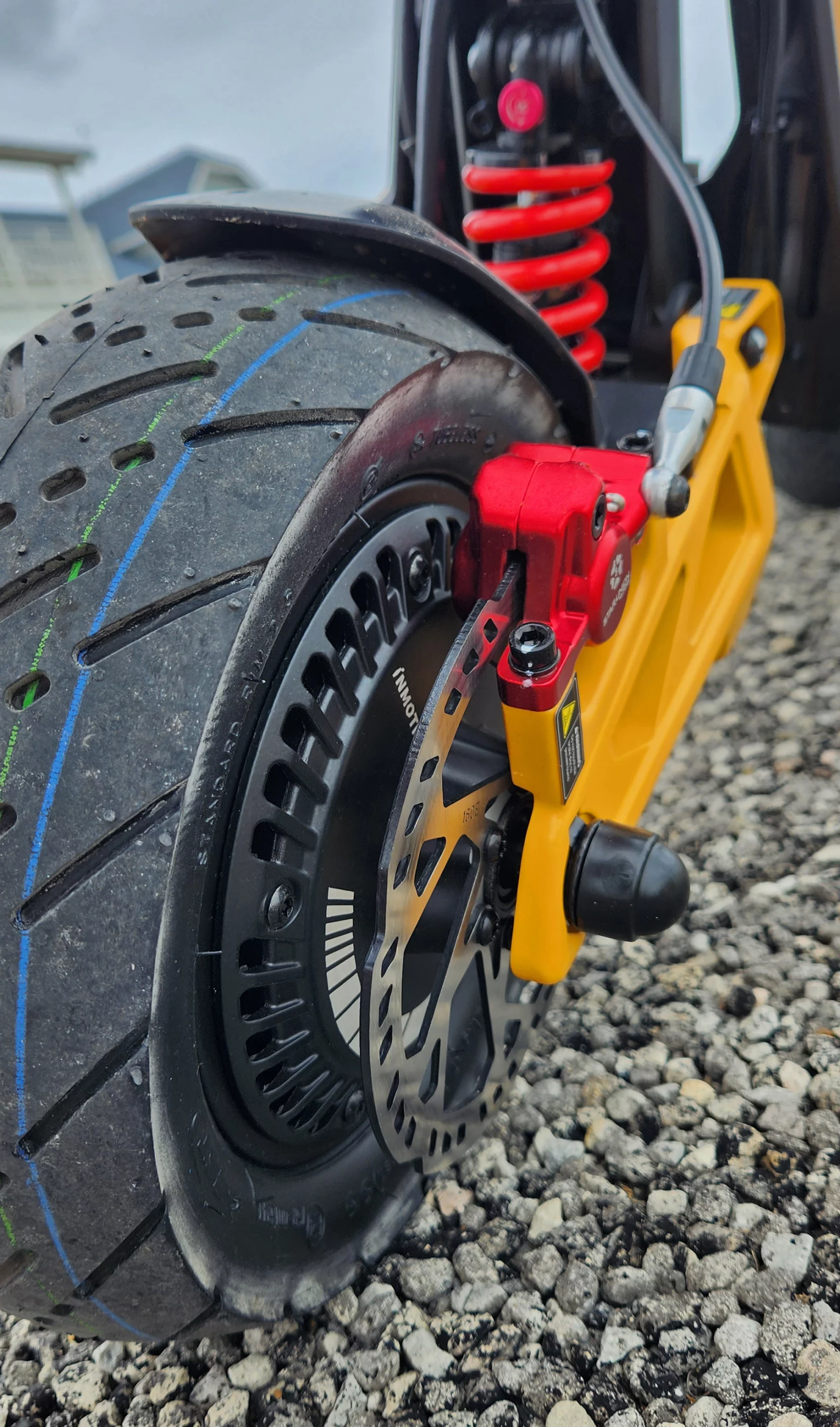 The front setup basically mirrors the rear. Same shock, same swing arm, same caliper and rotor.
