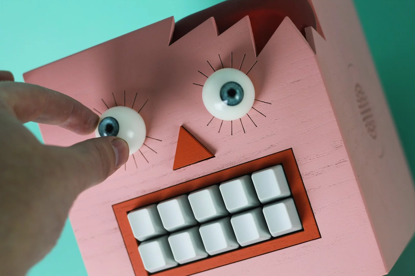 Mr Typo's garbled output can be modulated by twisting his eyeballs or poking his teeth