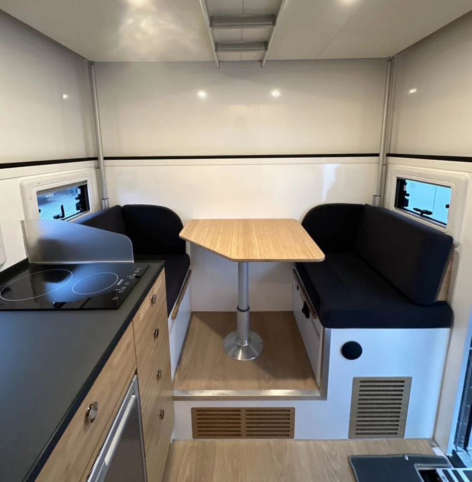 The unit with separate, non-entry wet bath has a smaller two-person dinette just to the side of the entryway