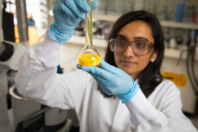 More power to science: PhD student Kosswattaarachchi with a flask containing super dye BODIPY