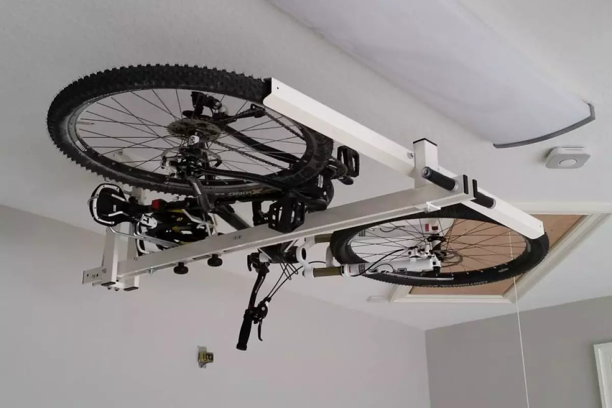 The flat-bike-lift utilizes pneumatic and hydraulic pistons, to make the pushing and pulling easier