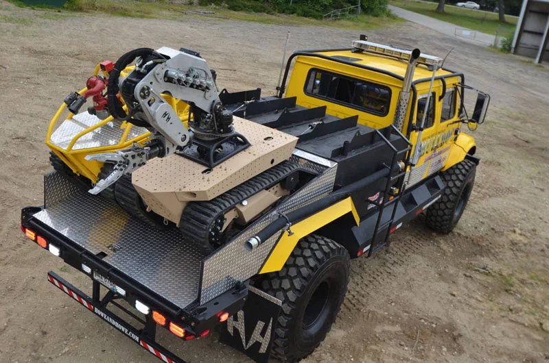 The RS1-T2 Thermite firefighting robot and a Guardian robot on the Bulldog firefighting truck