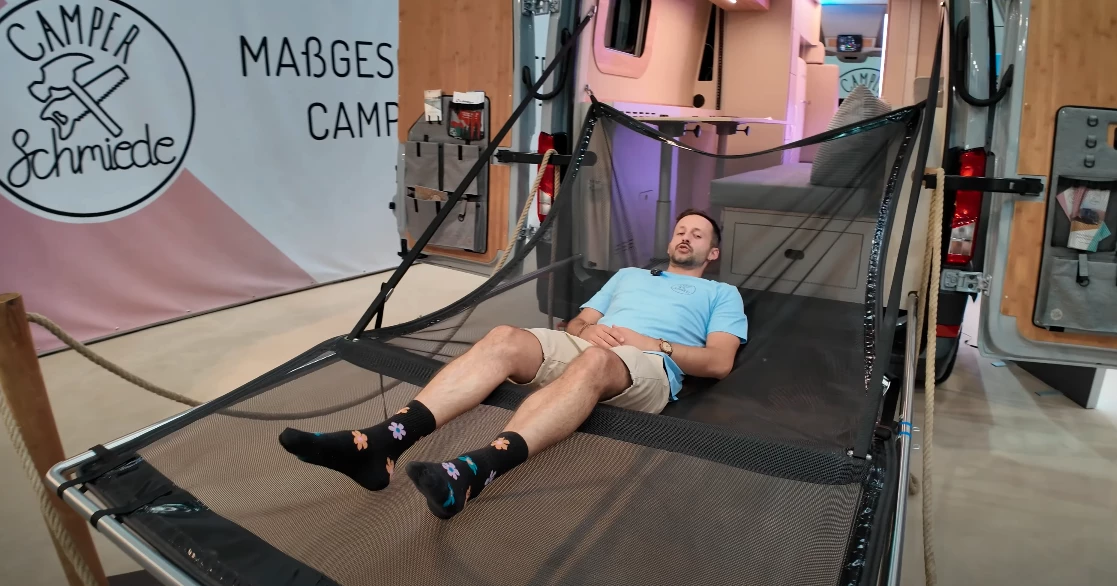 Lying out down low in Camper Schmiede's Soul Floater tailgate lounger