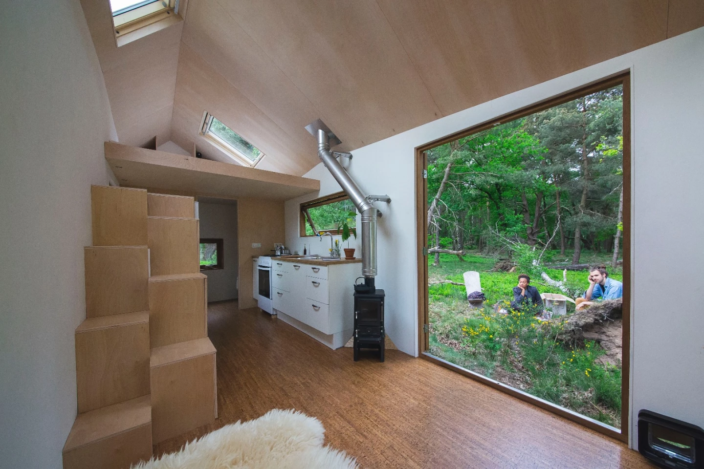 Entering via the generous glazed doors which open wide to let the outside in, a visitor is greeted by a relatively large and open interior space