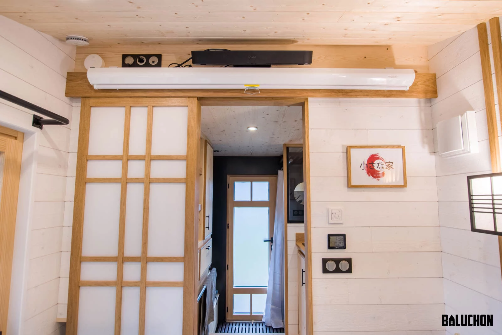 The Bonzai tiny house's multipurpose living room has a home cinema setup